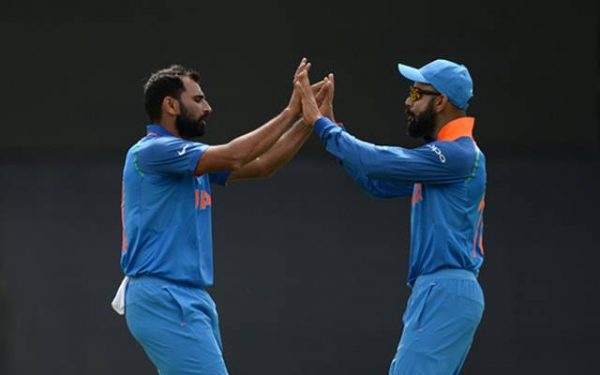 Mohammed Shami with Virat Kohli (Photo by Philip Brown/Getty Images)