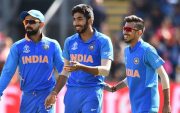 India's Jasprit Bumrah (C) celebrates with India's captain Virat Kohli (L) and teammates after taking the wicket of Bangladesh's Soumya Sarkar for 25 during the 2019 Cricket World Cup warm up match between Bangladesh v India at Sophia Gardens stadium in Cardiff, south Wales, on May 28, 2019. (Photo by Glyn KIRK / AFP) (Photo credit should read GLYN KIRK/AFP/Getty Images)