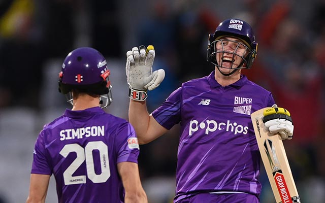 Harry Brook celebrates victory with John Simpson
