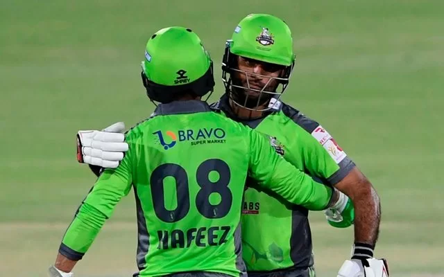 Mohammad Hafeez celebrates with teammate Fakhar Zaman. (Photo by Asif HASSAN / AFP) (Photo by ASIF HASSAN/AFP via Getty Images)