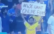 CSK fan with placard (Photo Source: Twitter)