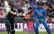 Eoin Morgan and MS Dhoni. (Photo by Gareth Copley/Getty Images)