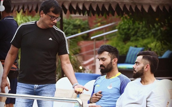 Virat Kohli with Dinesh Karthik and Trainer Basu. (Image Source: Twitter)