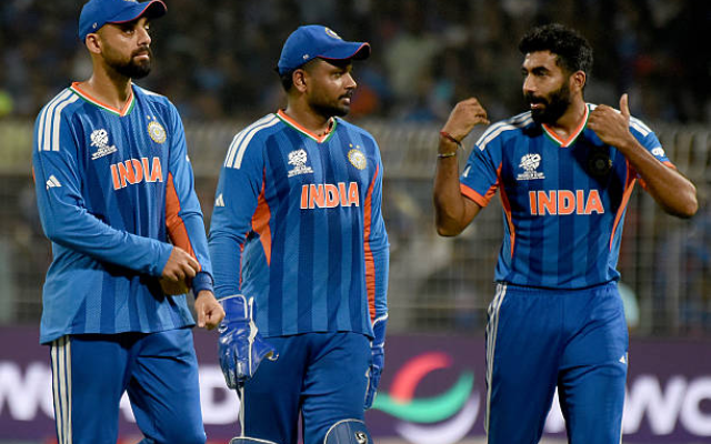 Varun Chakaravarthy (left), Sanju Samson (middle), Jasprit Bumrah (right) (image via getty)